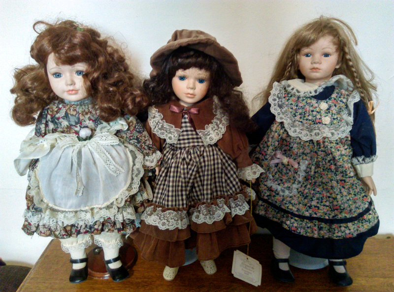 porcelain dolls on stands